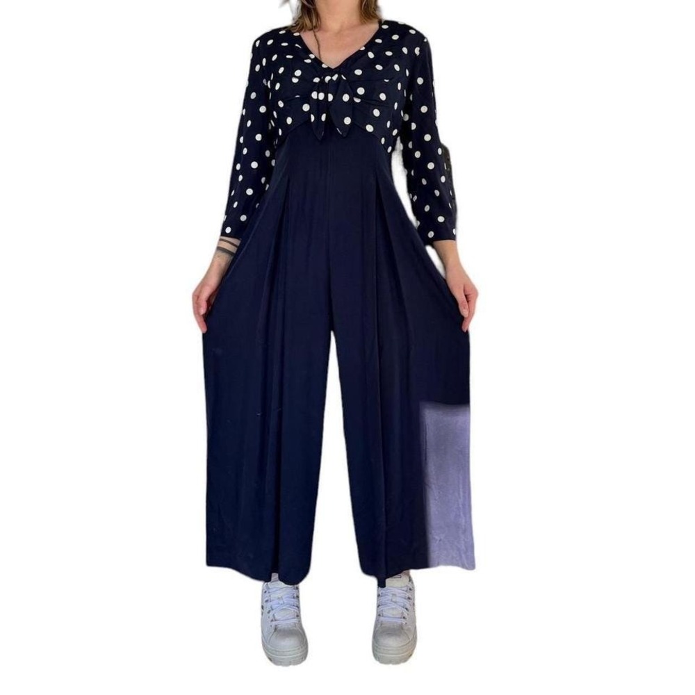 vintage navy polka dot one-piece jumpsuit with wide legs and classy retro look